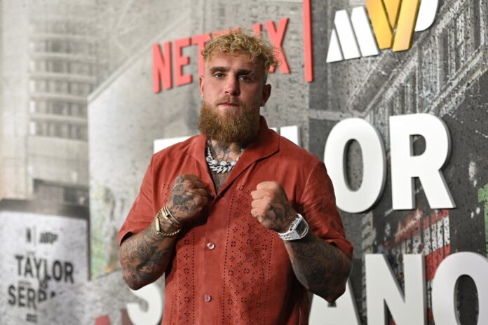 Jake Paul in a boxing stance with hands raised