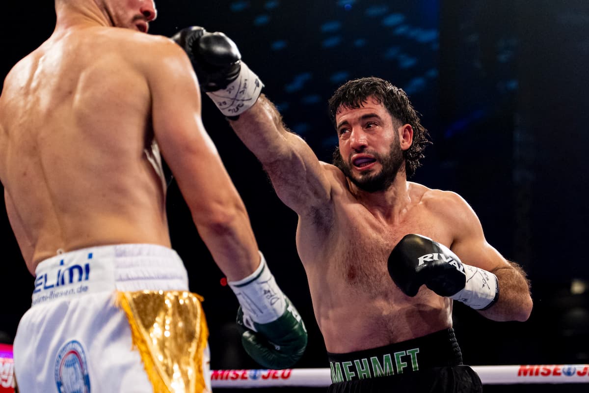 Mehmet Unal throws a punch during his bout against Altin Zogaj