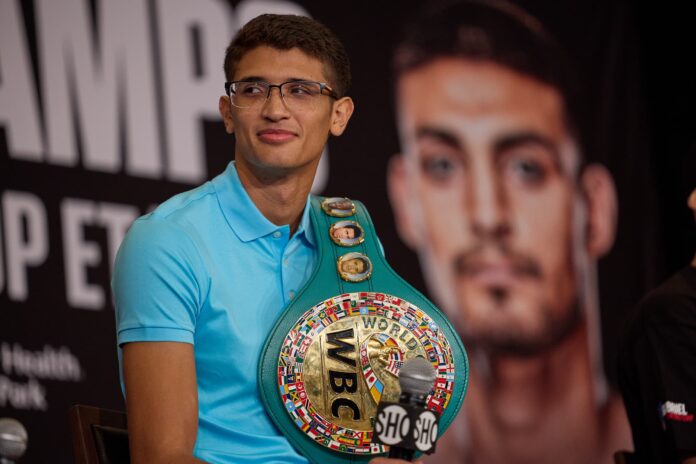 Sebastian Fundora holding his WBC belt during a press conference ahead of his upcoming boxing match
