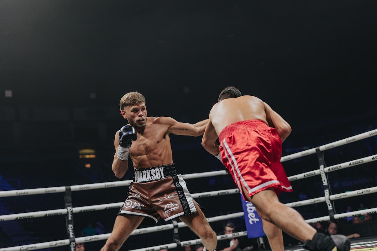 Ben Marksby lands a punch during his boxing match against Carlos Daniel Cordoba