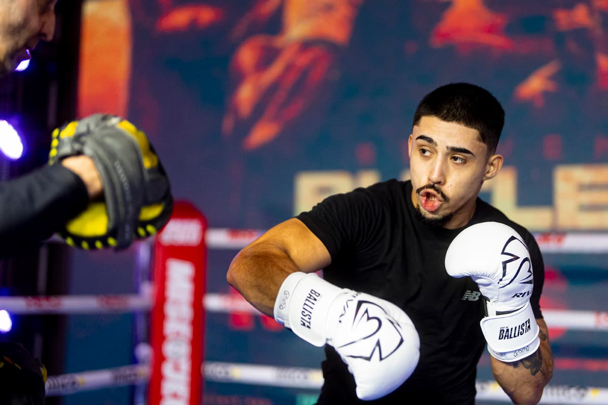 Dante Tice Oliveira punching mitts during an open workout
