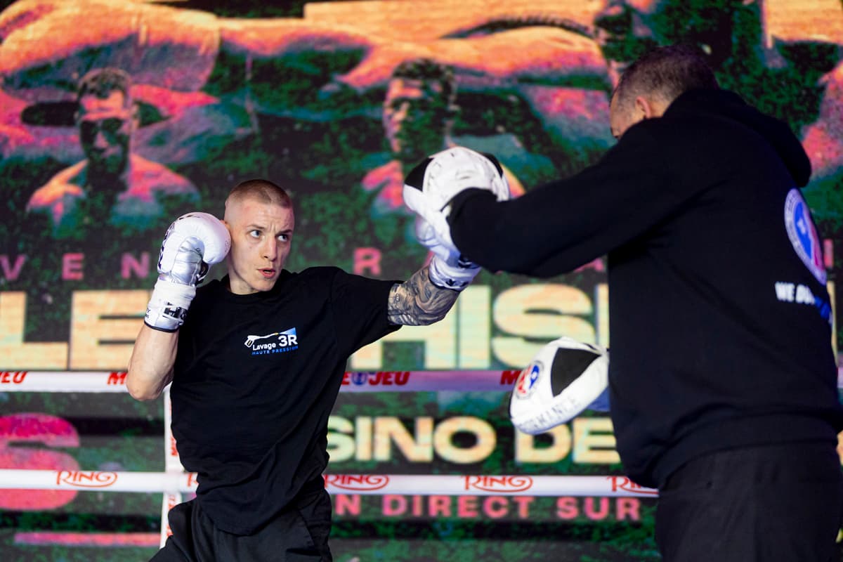 Daylen Pepin punching mitts during an open workout