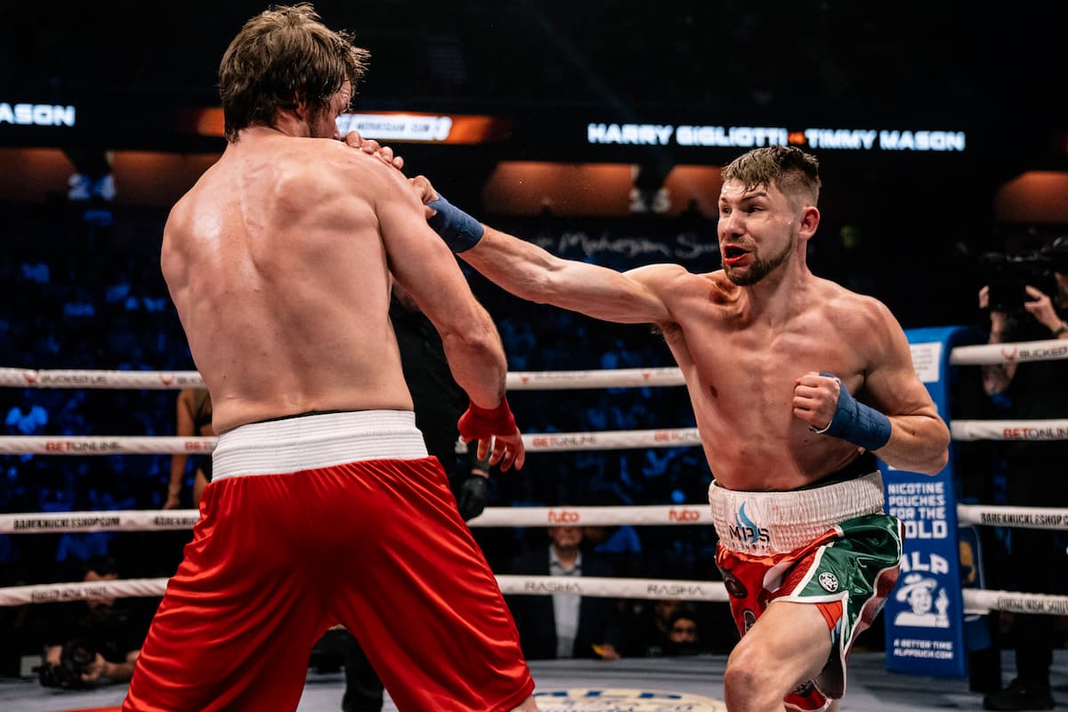 Harrison Gigliotti throws a punch during his bout against Timmy Mason