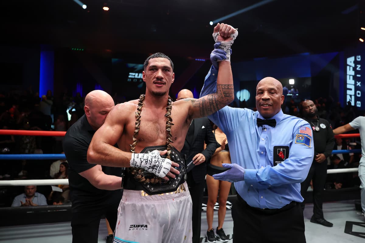 Referee Allen Huggins raises Jai Opetaia's hand in victory at Zuffa Boxing 4