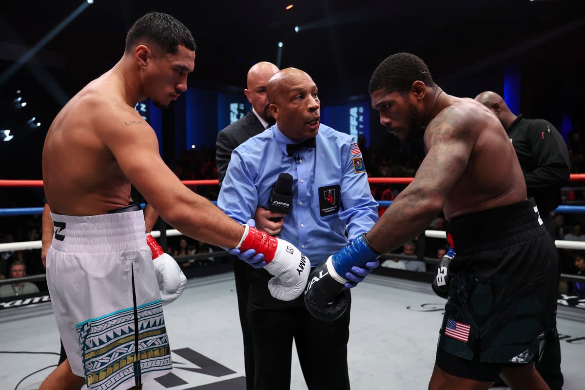 Jai Opetaia and Brandon Glanton touch gloves during their boxing match