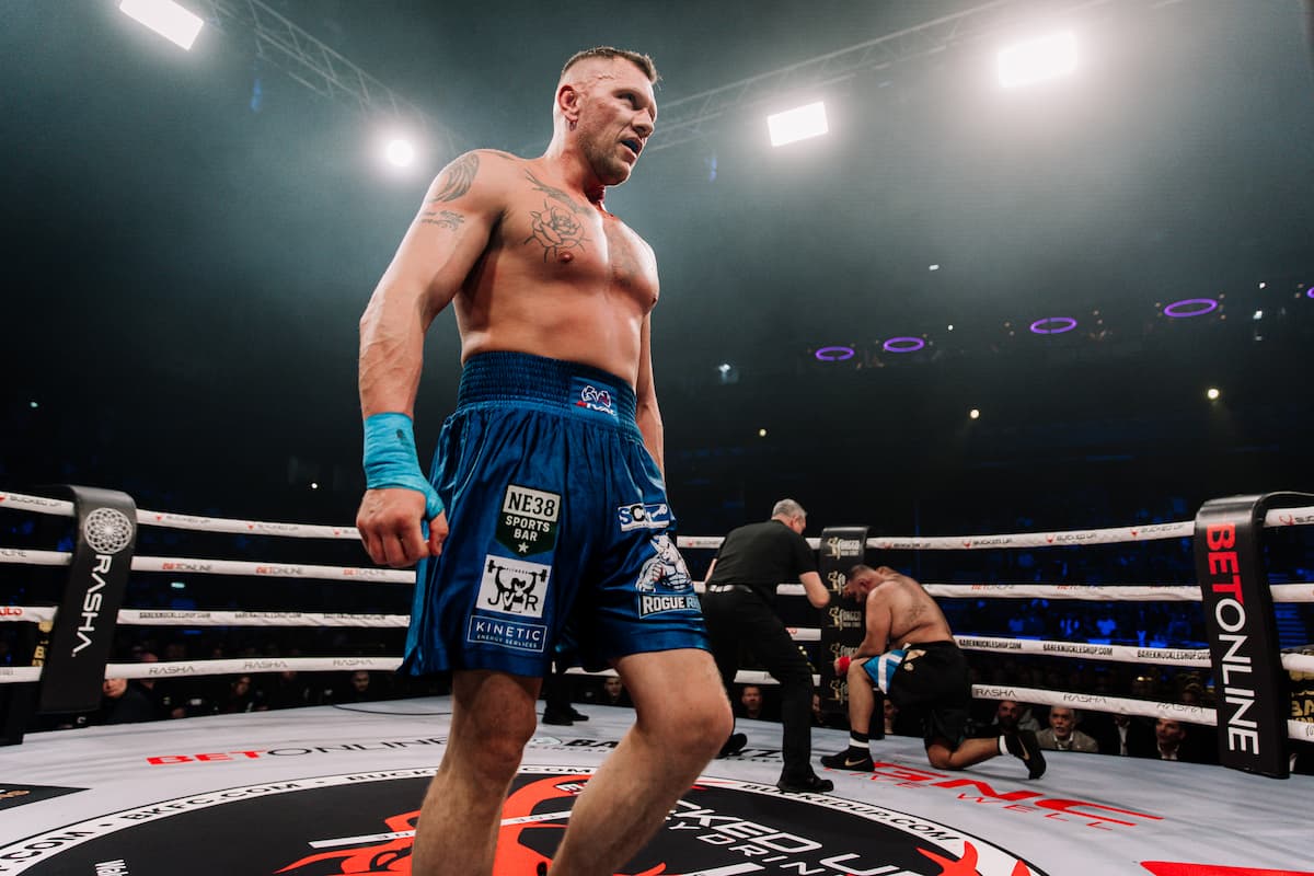 James Walker knocks down Mohammad Kaseem Saleem during their bout