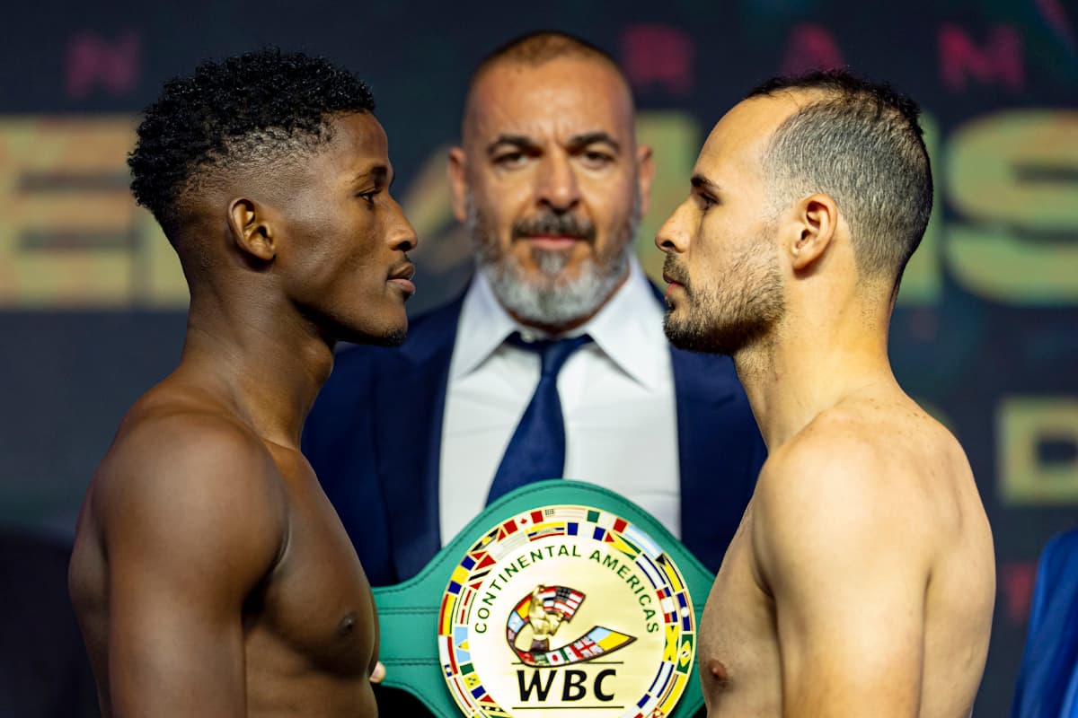 Jhon Orobio and Yomar Alamo face off during the weigh-in