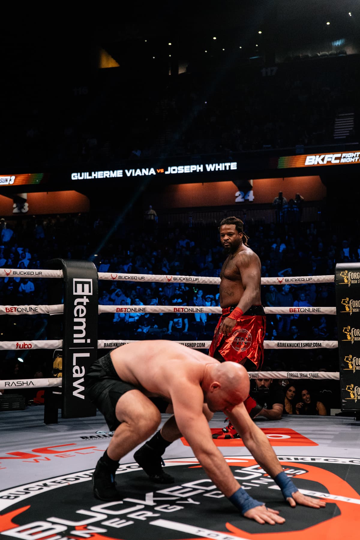 Joseph White knocks down Guilherme Viana during their bout