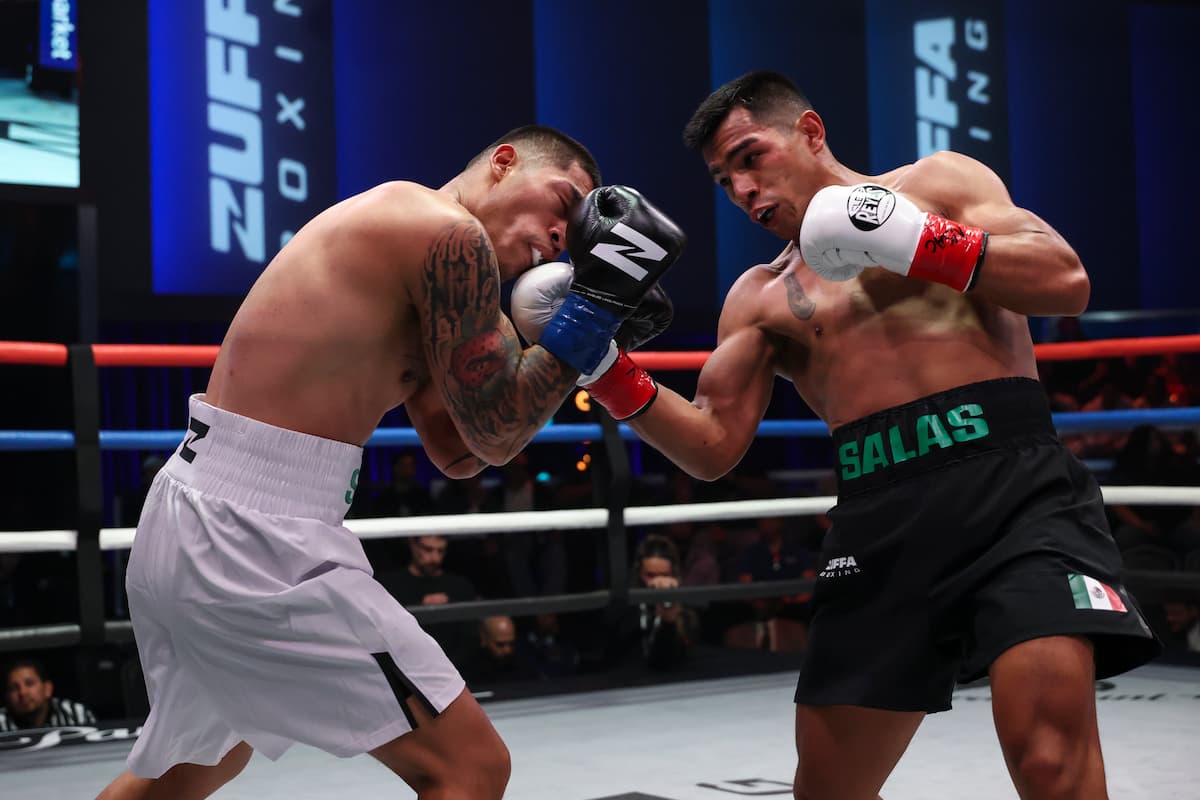 Ricardo Salas lands an uppercut during his boxing match against Jesus Saracho