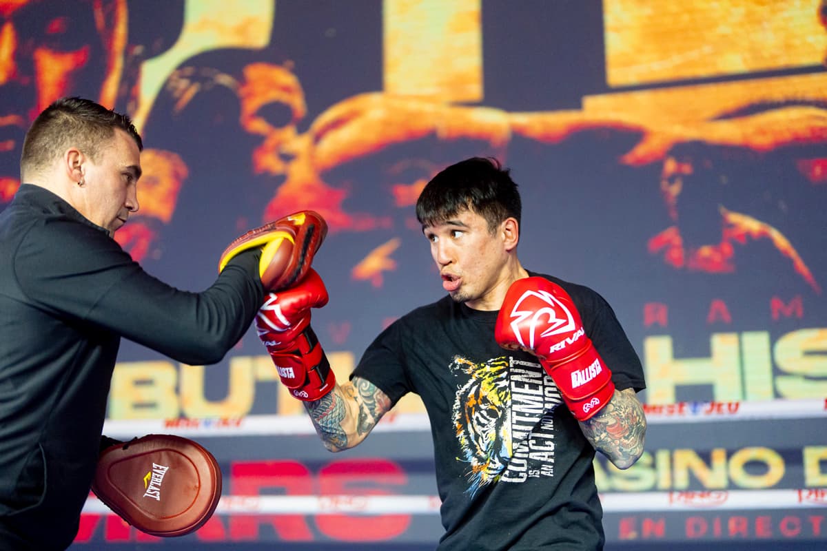 Steve Claggett punching mitts during an open workout