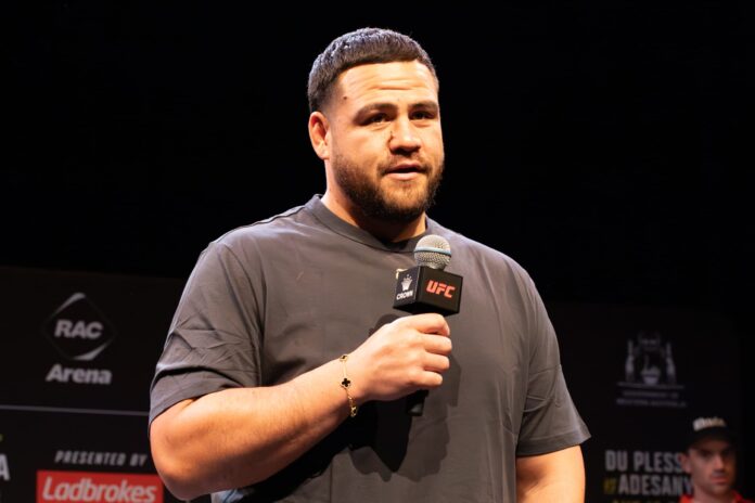 Tai Tuivasa holds a microphone during the UFC open workout in Perth