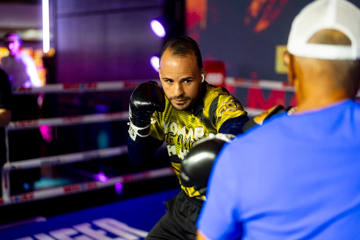 Yomar Alamo punching mitts during an open workout