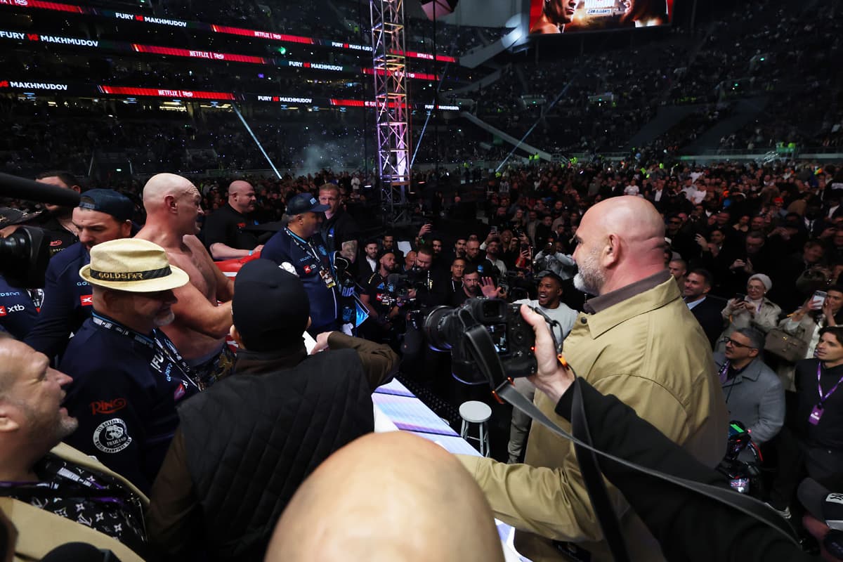 Tyson Fury calls out Anthony Joshua as Joshua stands outside the ring surrounded by a crowd