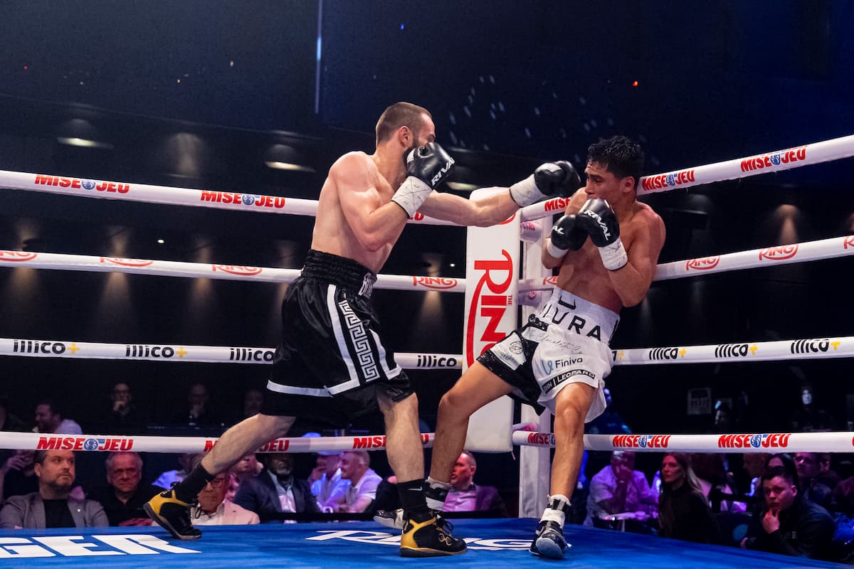 Arthur Biyarslanov throws a punch during his boxing match against Jimerr Espinosa