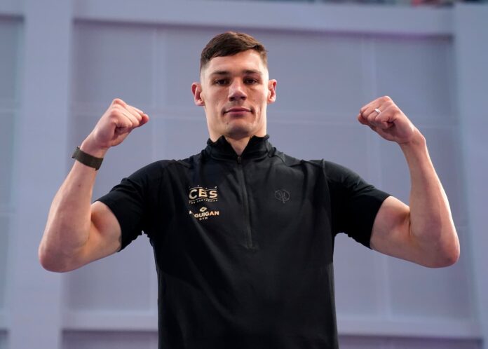 Chris Billam-Smith posing with his hand raised during a media workout ahead of his boxing match