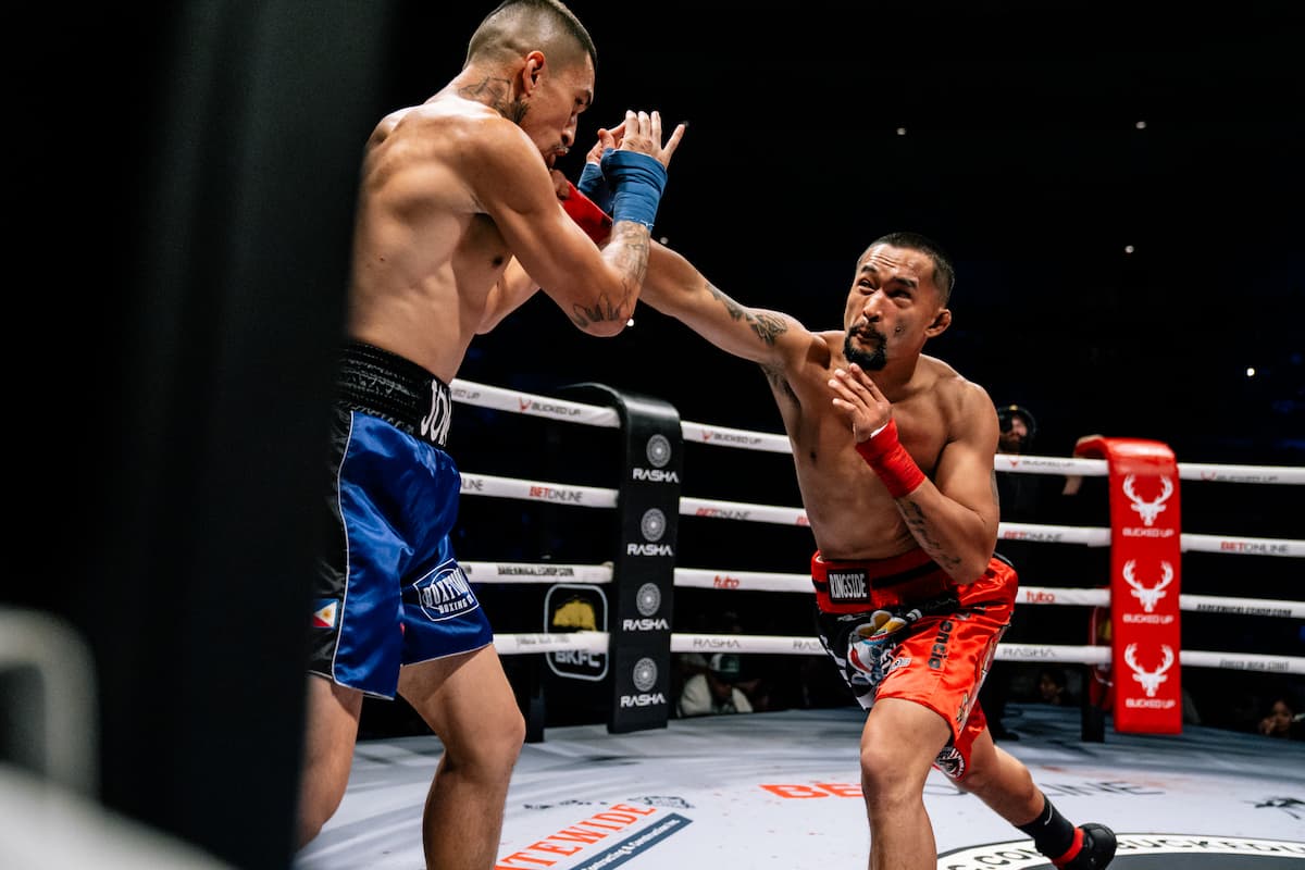 Christopher Inocencio throws a punch during his bout against Jovan Alayon