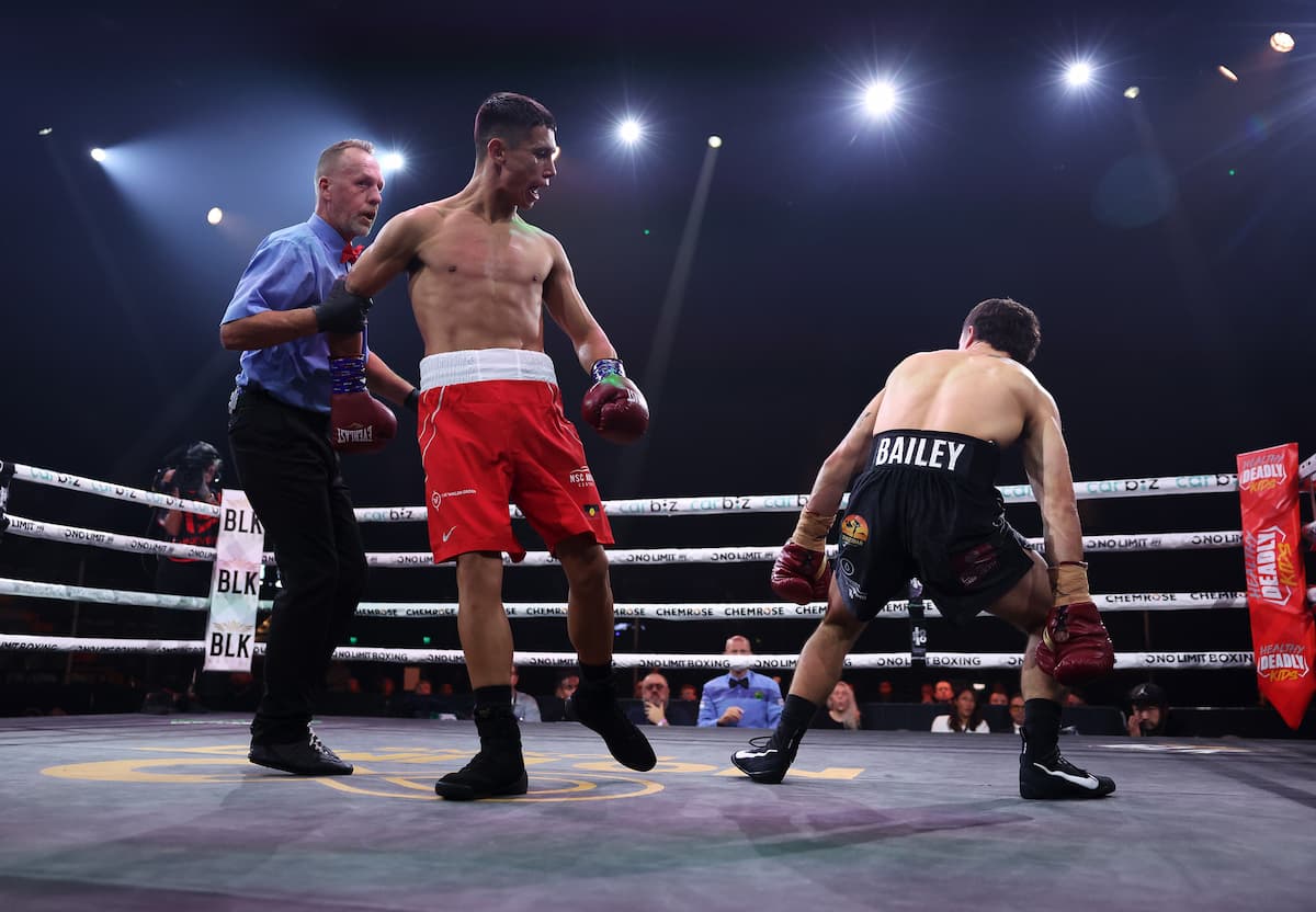 Dharringarra Trewhella knocks down Dominic Bailey during their boxing match
