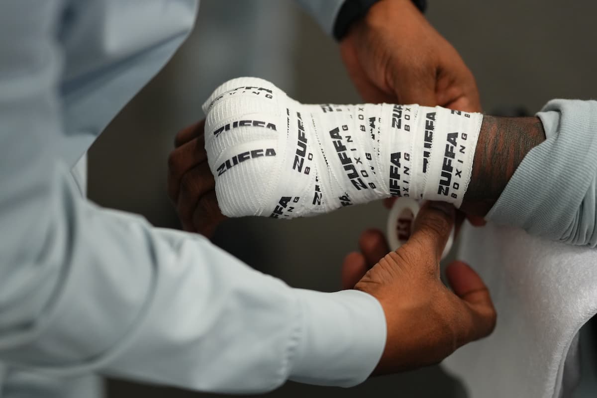 Boxer's hands being wrapped before a match