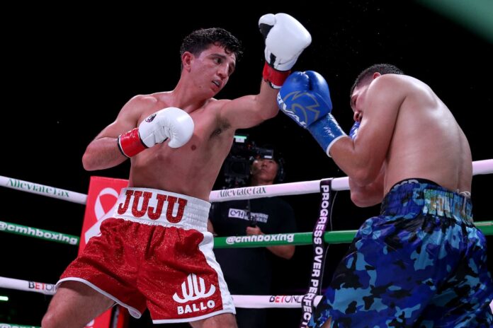 Julius Ballo throws a punch during his boxing match against Juan Centeno