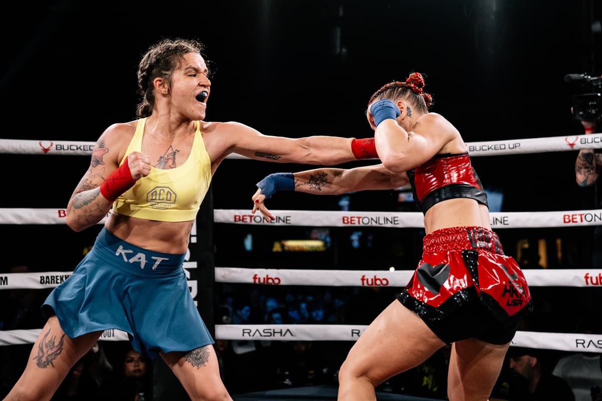 Kat Paprocki lands a jab during her bout against Crystal Van Wyk