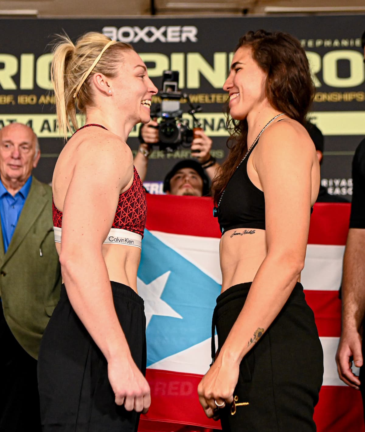 Lauren Price and Stephanie Pineiro face off at the weigh-in ahead of their boxing match at Utilita Arena Cardiff
