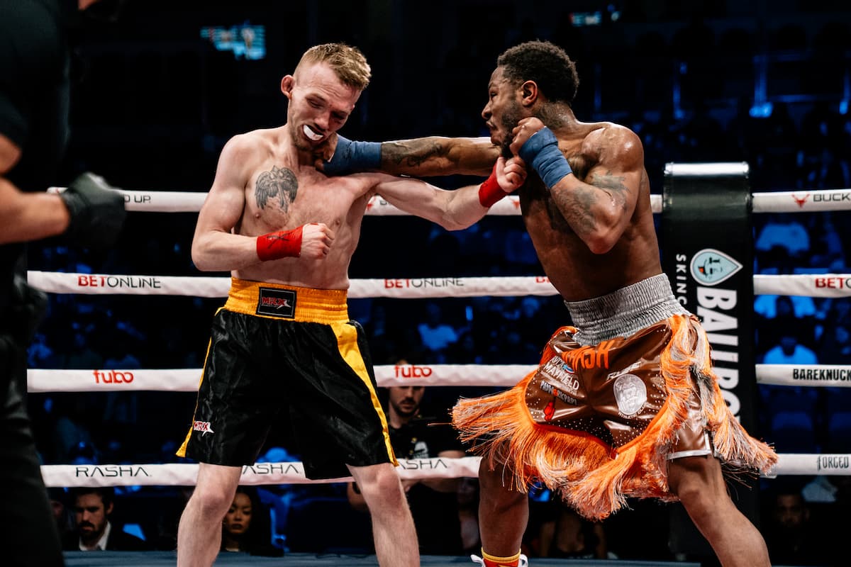 Octavin Turner lands a punch during his bare-knuckle boxing bout against Joby Steffensmeier