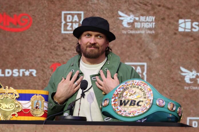 Oleksandr Usyk speaking at a press conference ahead of his boxing match against Rico Verhoeven