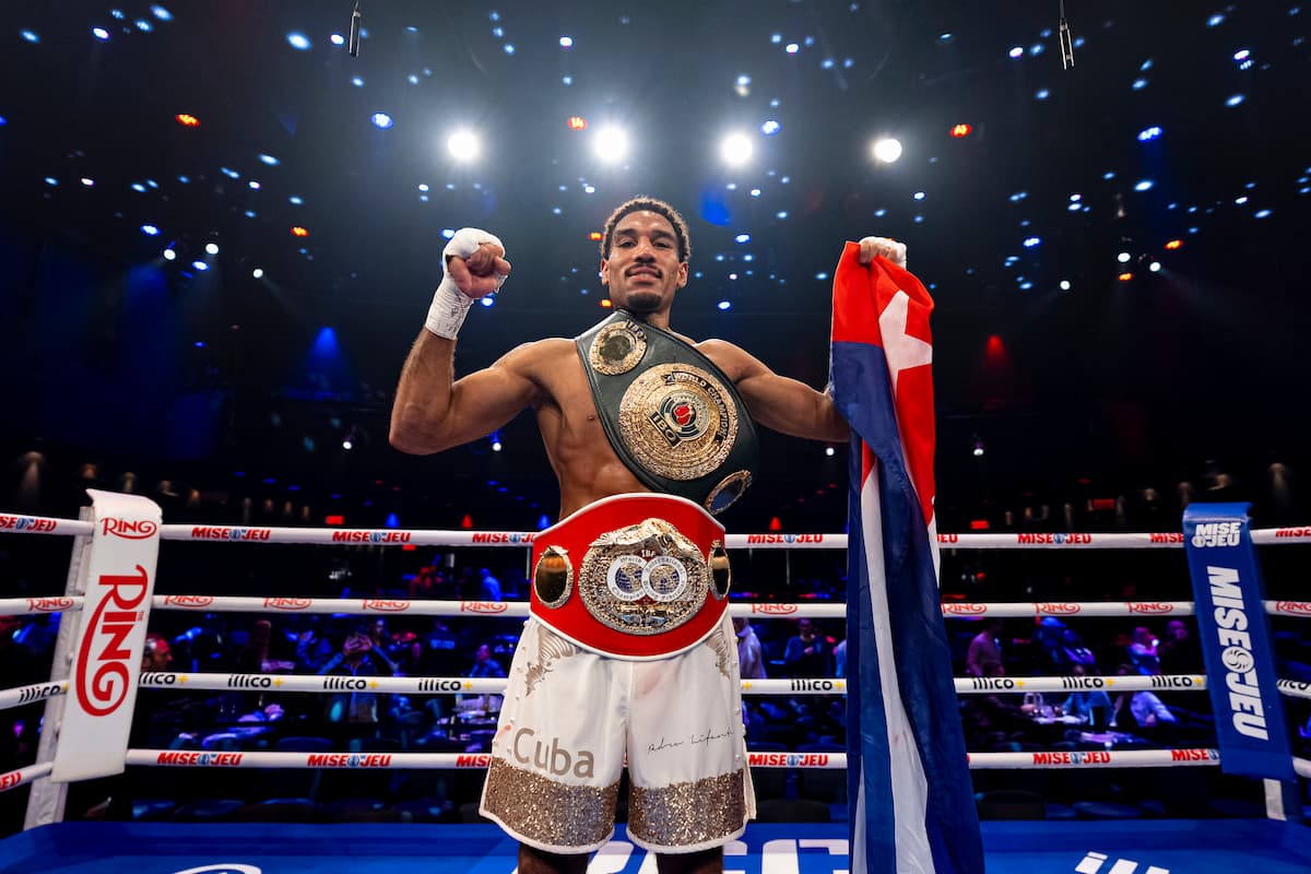 Osleys Iglesias posing with his IBF and IBO championship belts after his victory over Pavel Silyagin