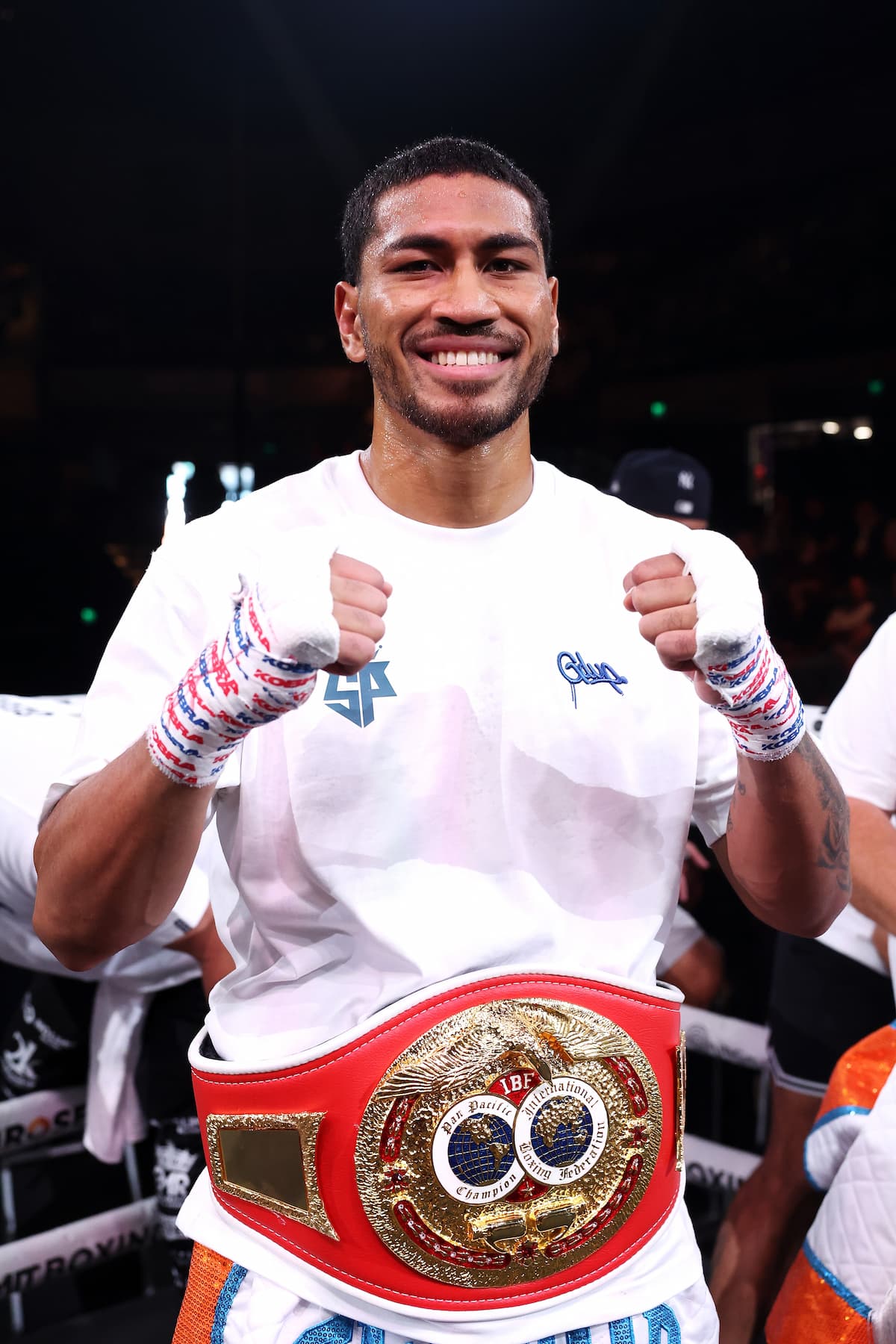 Paulo Aokuso posing in the ring after his victory over Kittipong Jian Hao Ho during their boxing match