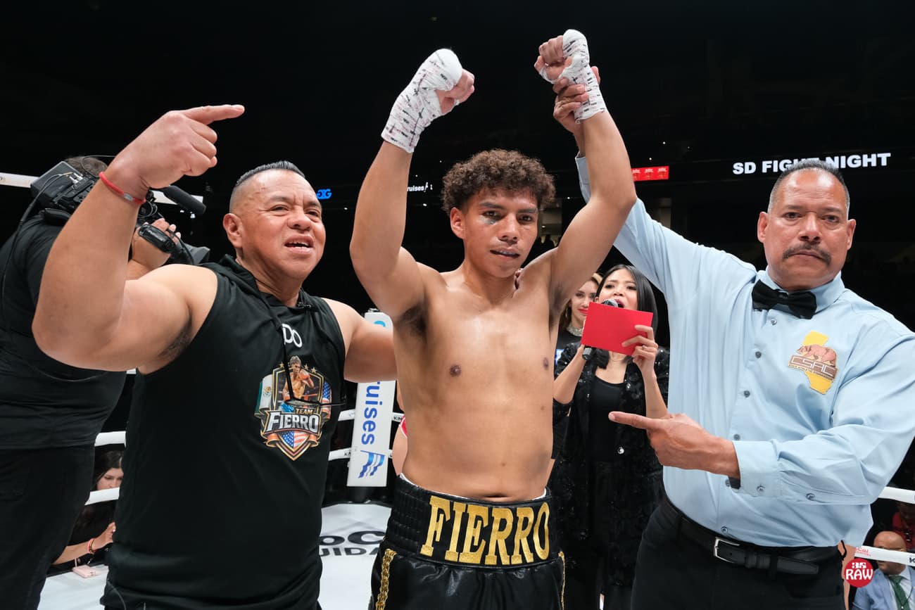 Referee raises Pedro Angel Cruz's hand in victory over Angel Juan Estrada
