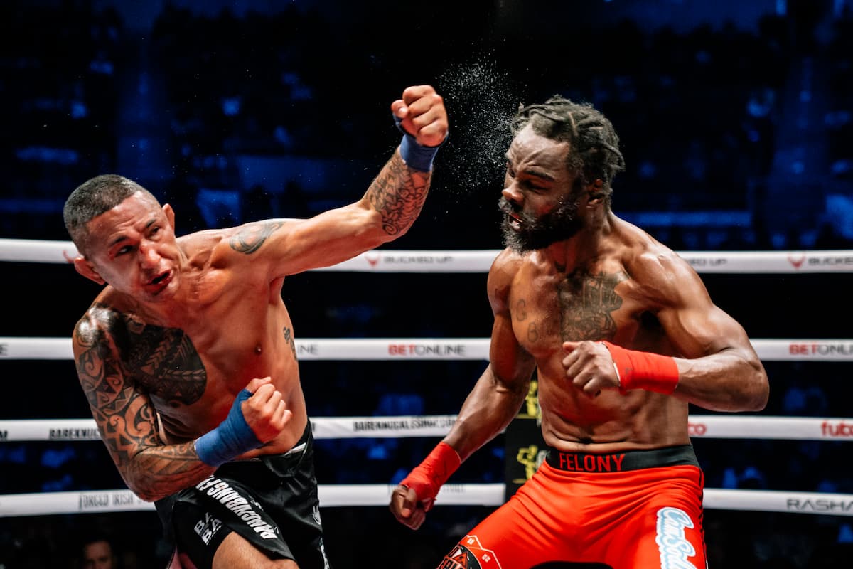 Toby Misech throws a punch during his bout against Charles Bennett