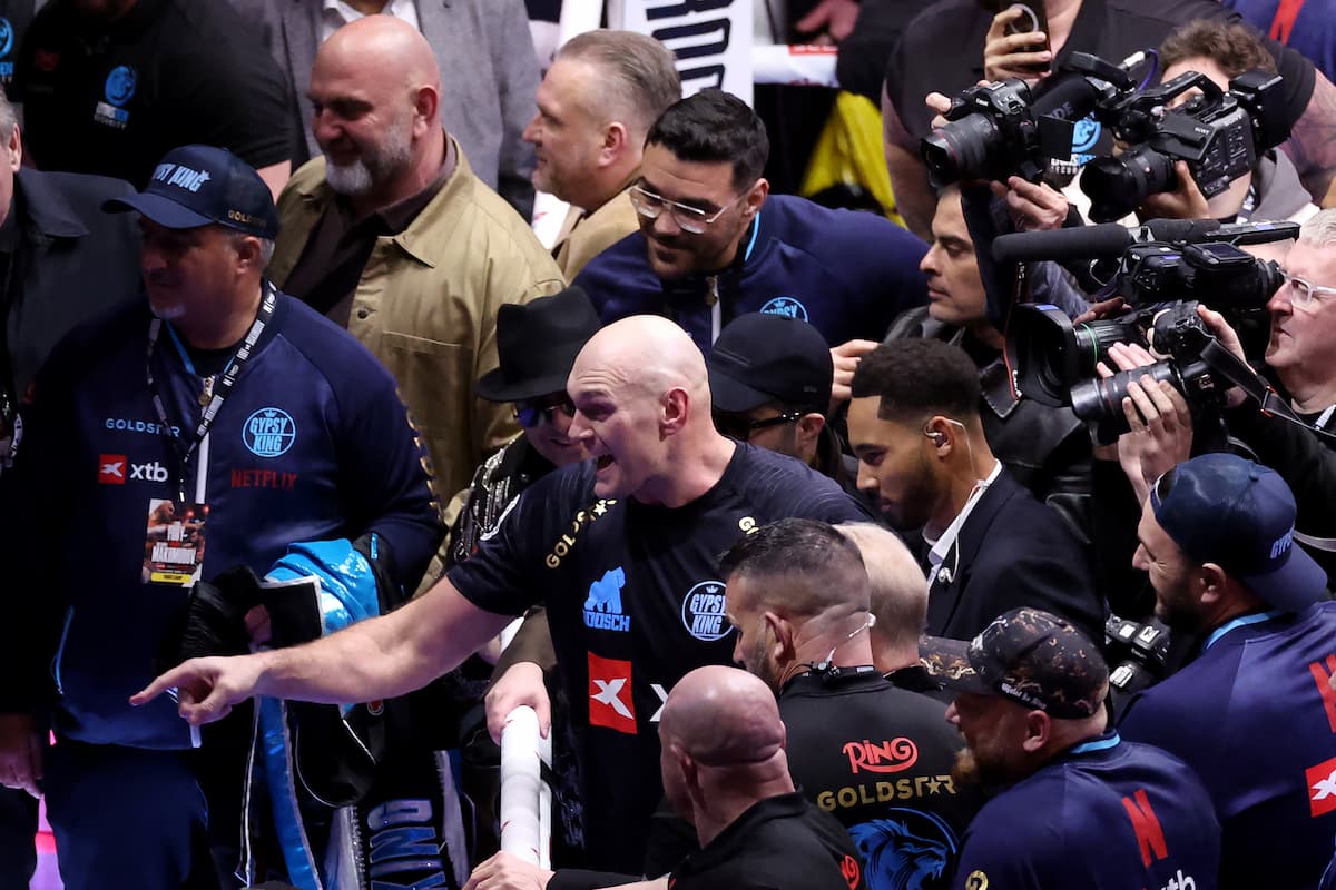 Tyson Fury pointing with his finger while standing in the boxing ring during a post-fight moment