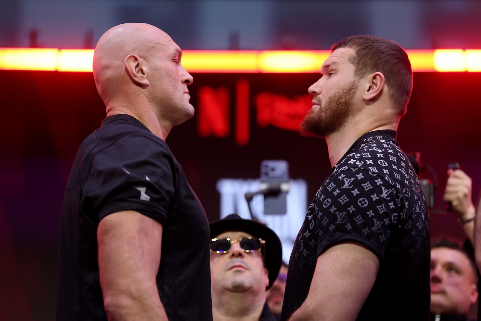 Tyson Fury and Arslanbek Makhmudov face off at the weigh-in ahead of their boxing match in London