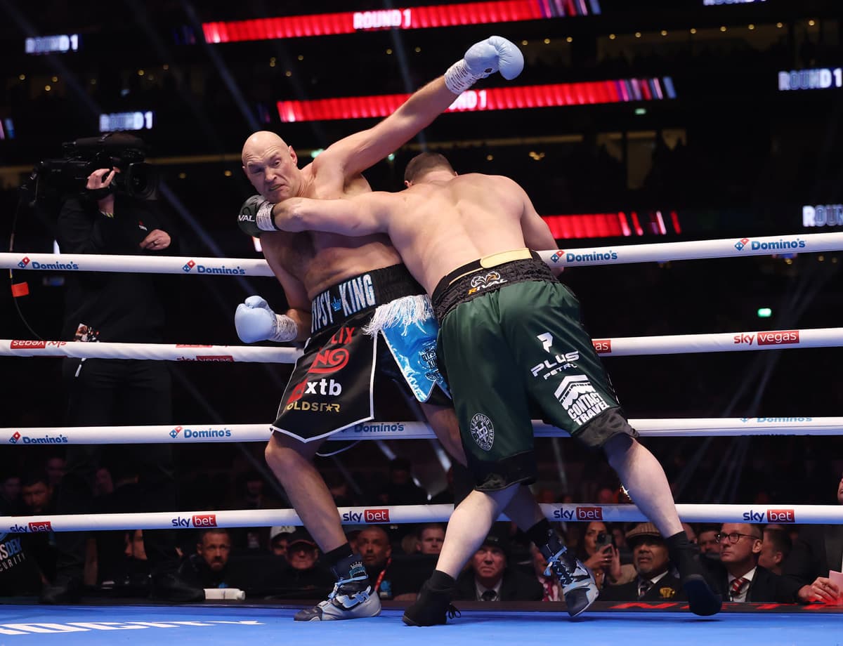 Tyson Fury leans back on the ropes as Arslanbek Makhmudov attacks during their fight