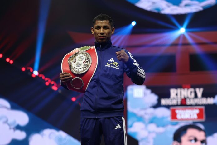Willibaldo Garcia posing with his IBF championship belt during the Grand Arrivals event