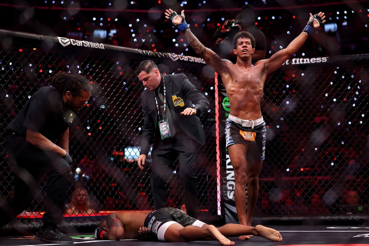Adriano Moraes walking off as Phumi Nkuta is down on the canvas