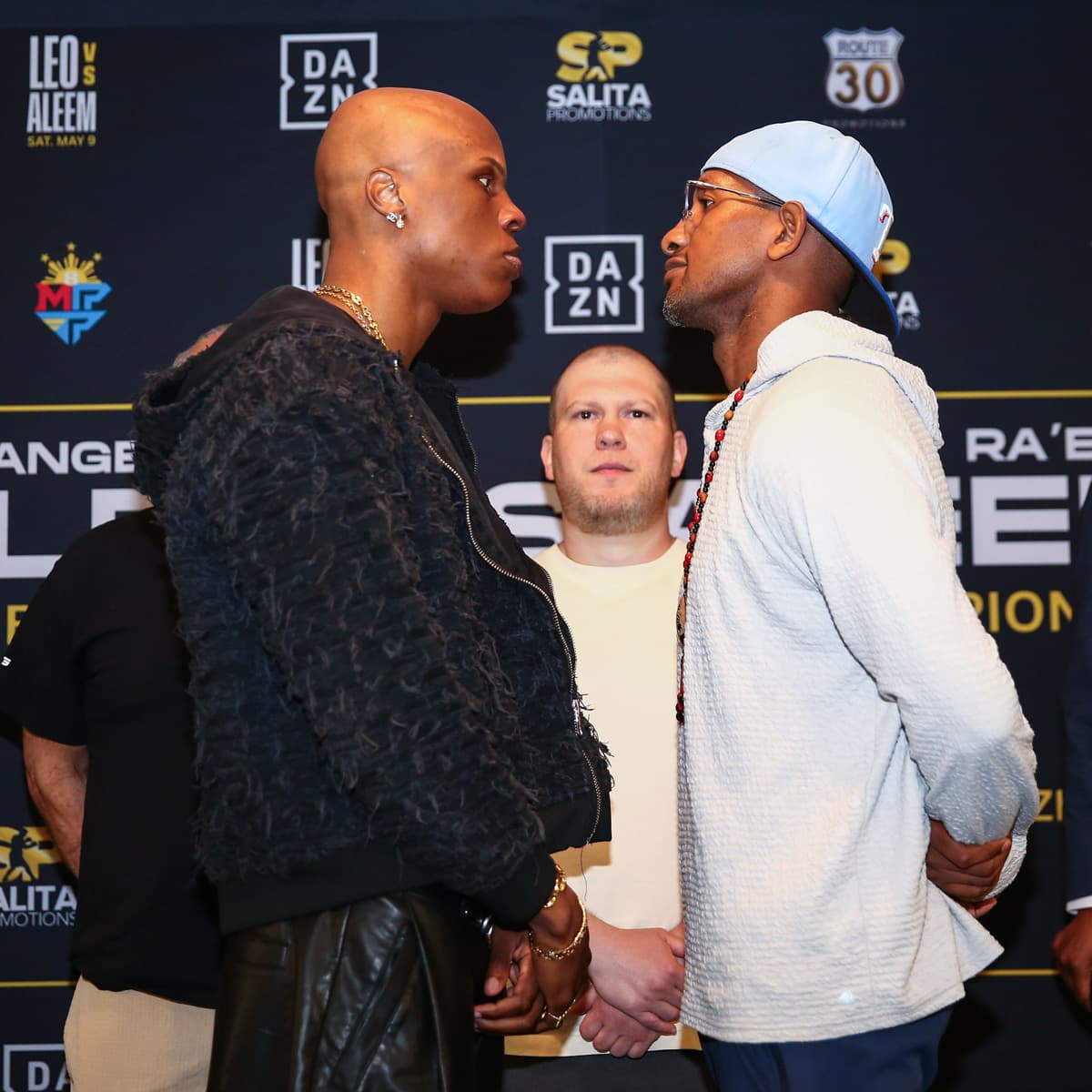 Atif Oberlton and Carlos Gongora face off at press conference