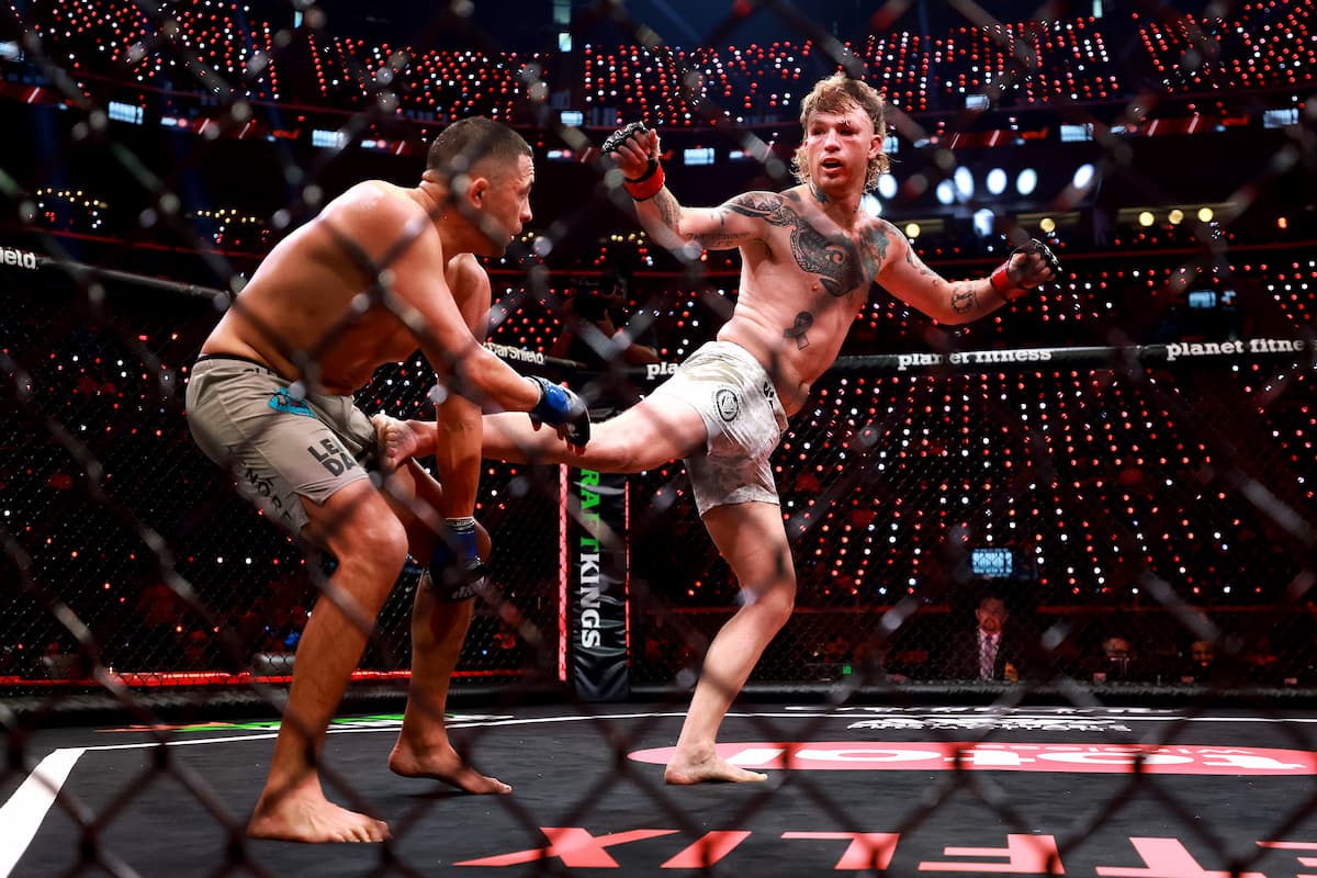 Brandon Jenkins lands a kick during his bout against Chris Avila