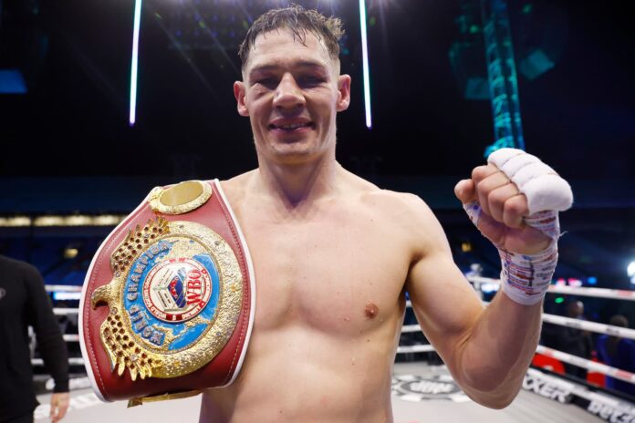 Chris Billam-Smith poses with the WBO title belt after victory