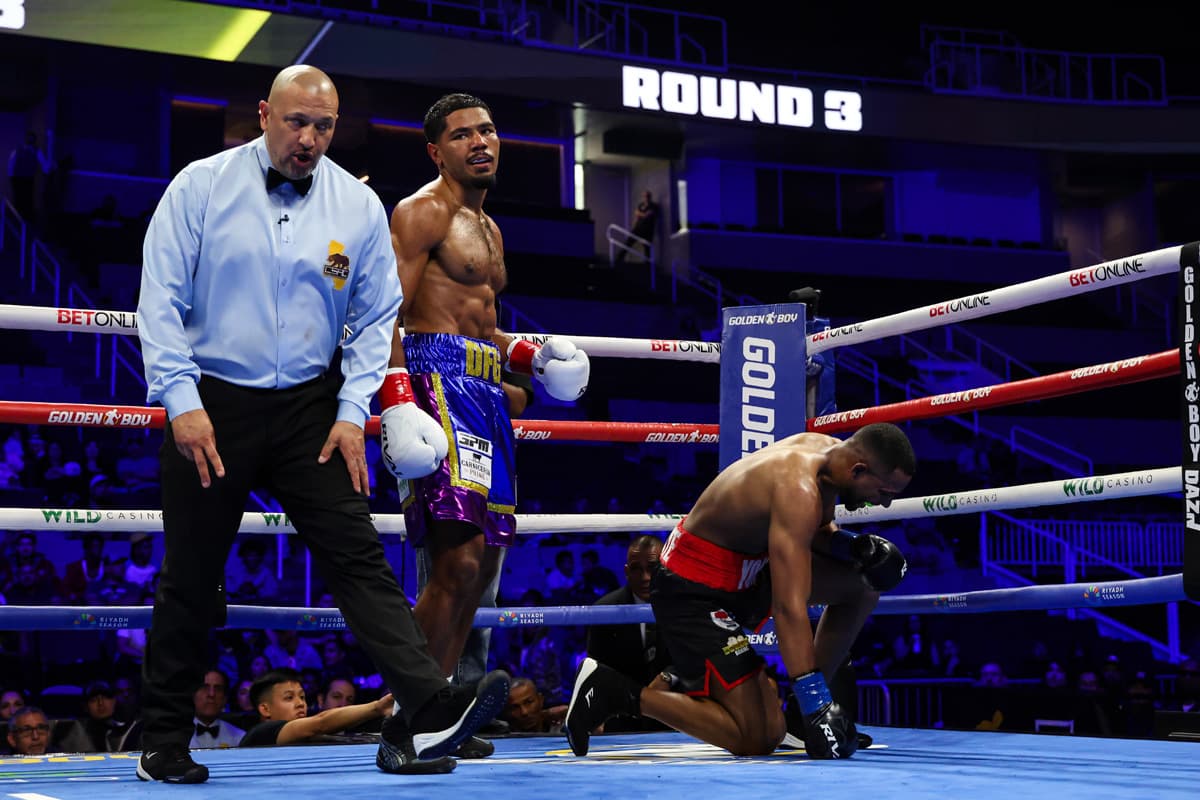 Darius Fulghum knocks down Yoanki Urrutia during boxing bout