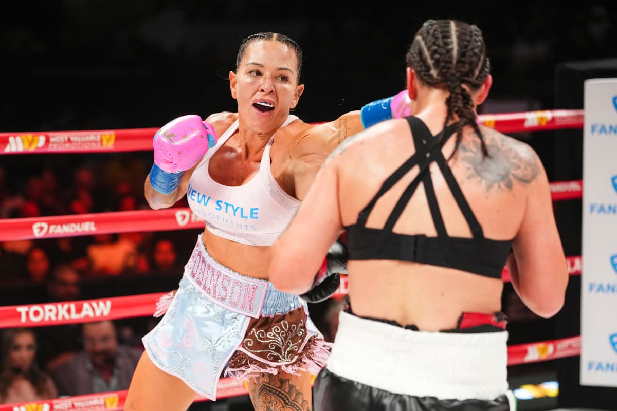 Desley Robinson throws a jab during her bout against Mary Spencer