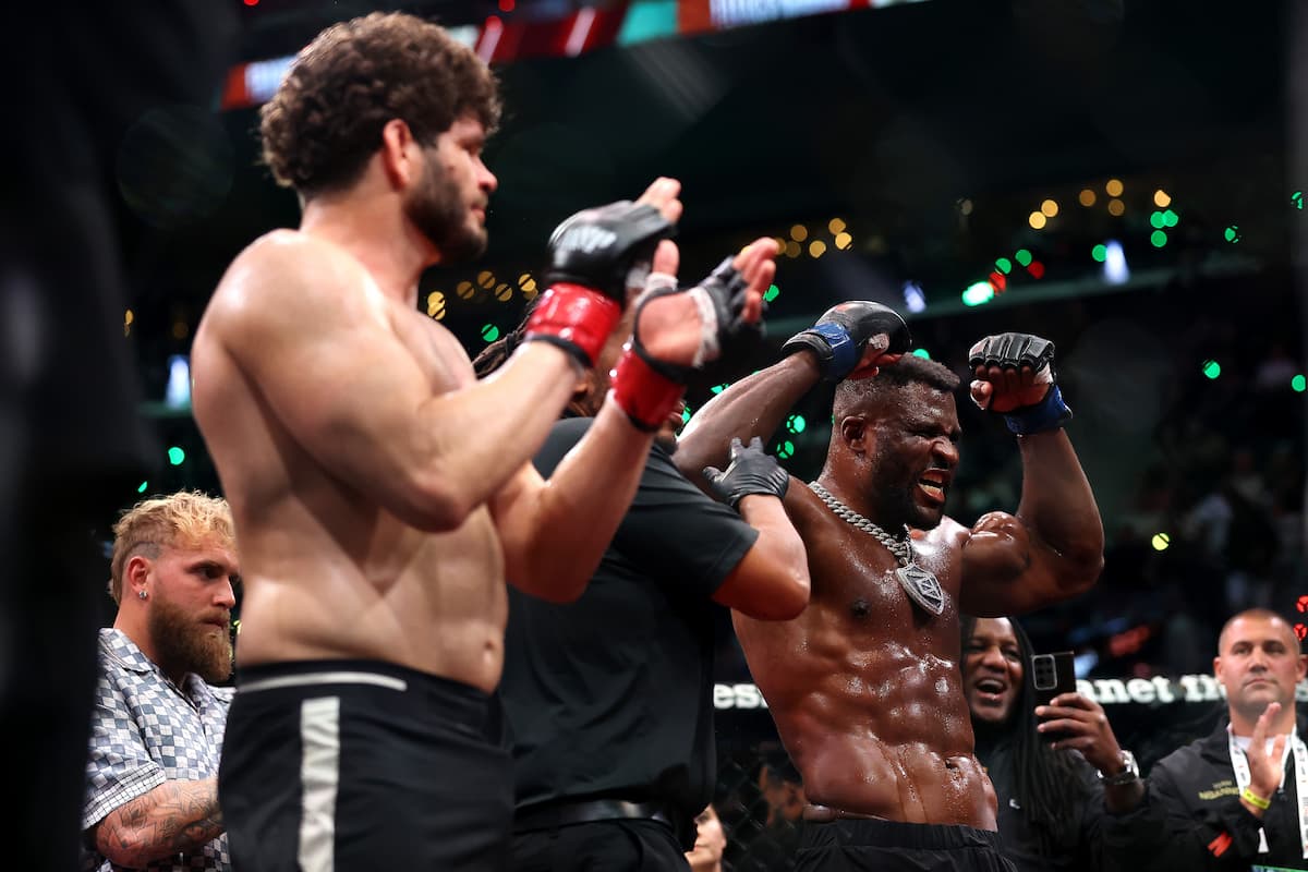 Francis Ngannou having his hand raised in victory over Philipe Lins