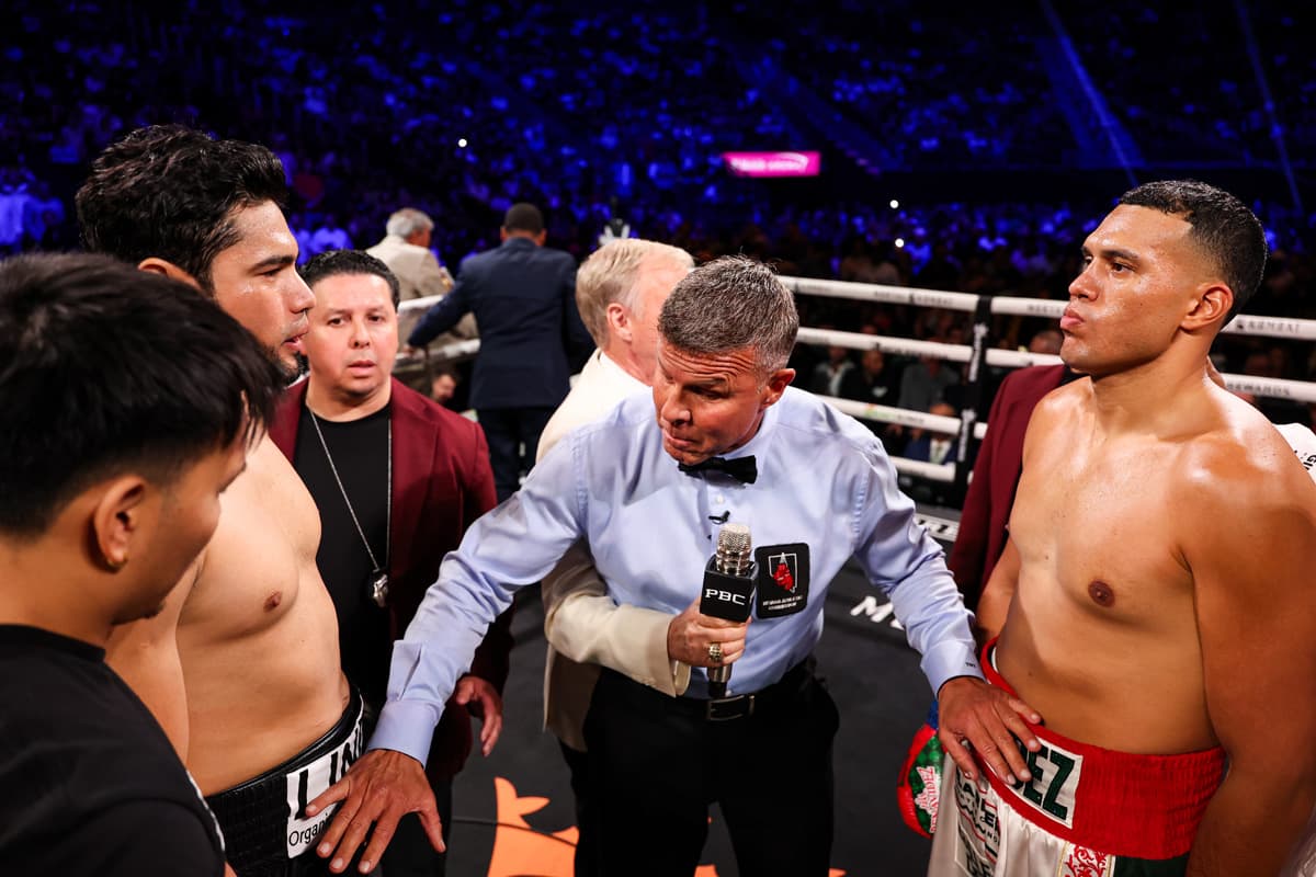 Referee Thomas Taylor giving instructions to Gilberto Zurdo Ramirez and David Benavidez before their fight