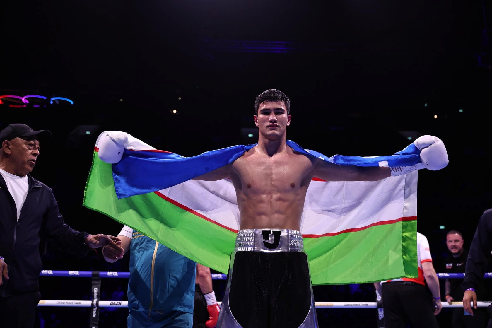 Javokhir Ummataliev poses after his victory over Damian Drabik during their bout