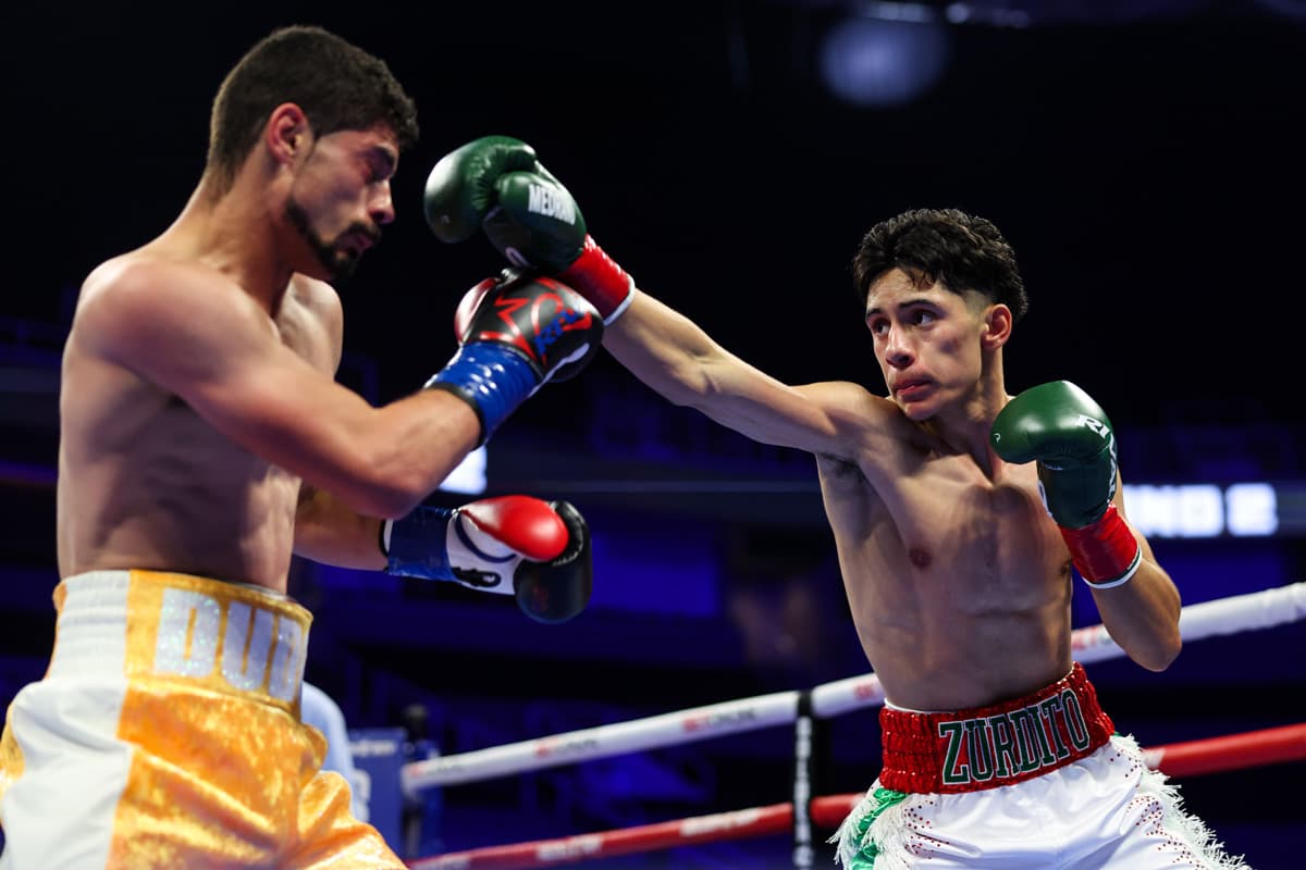 Jose Medrano Jr throws a jab during boxing bout against Anel Dudo