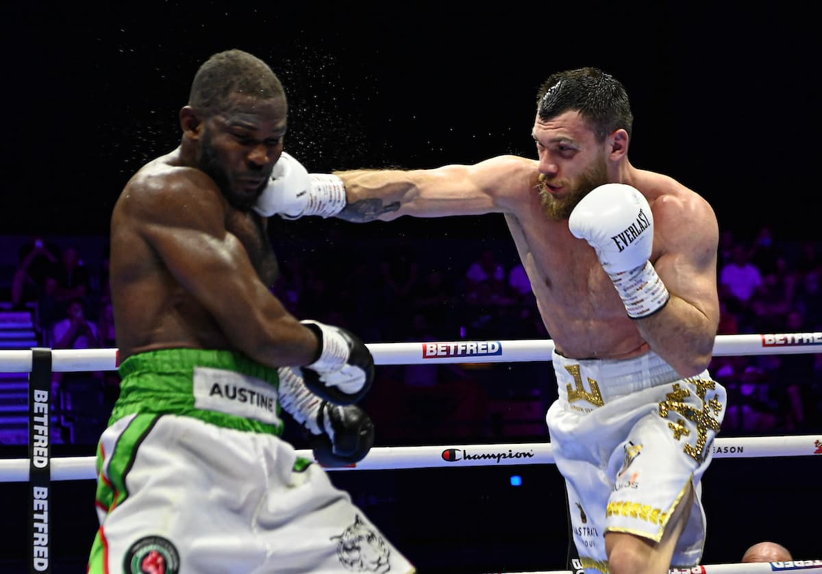 Juergen Uldedaj lands a punch during his bout against Austine Nnamdi