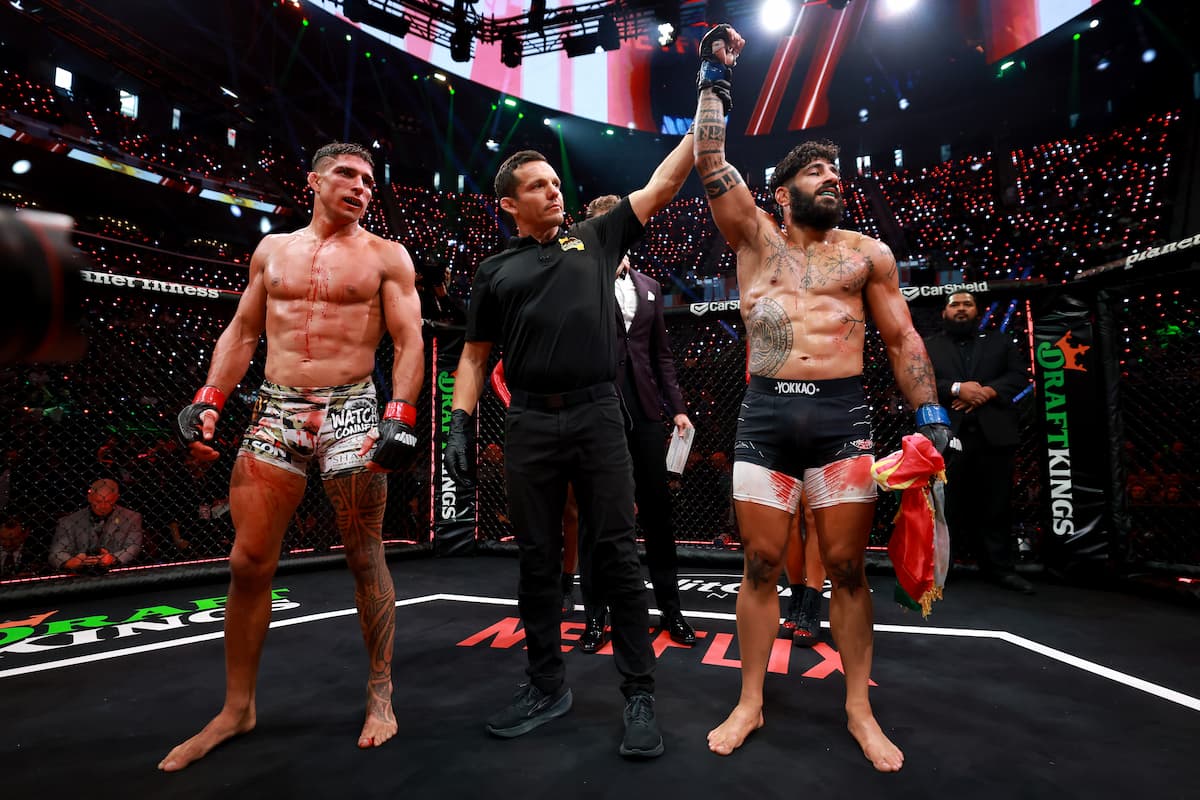 Namo Fazil having his hand raised in victory against Jake Babian