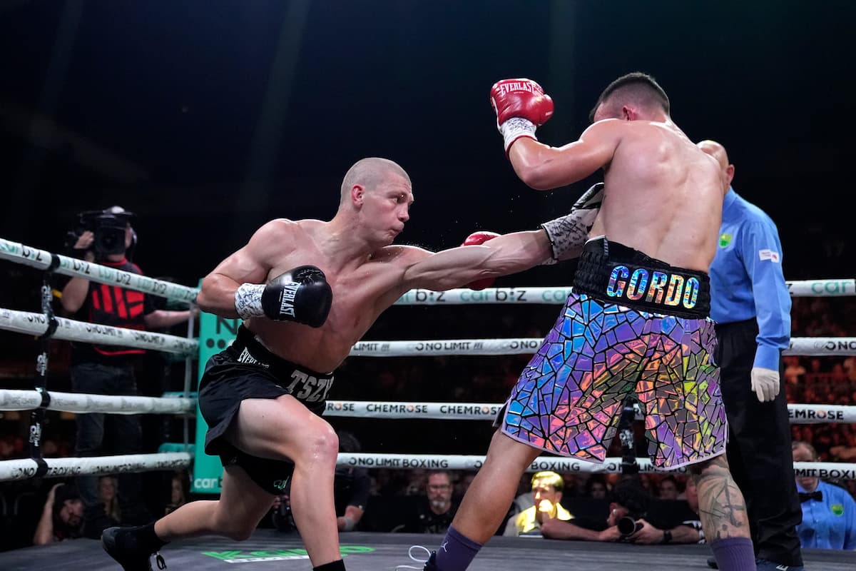 Nikita Tszyu lands a body punch during his bout against Oscar Diaz