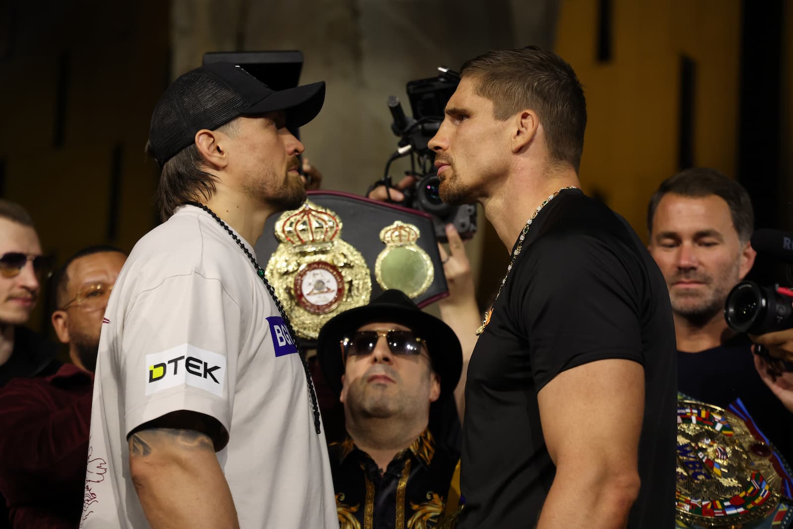 Oleksandr Usyk and Rico Verhoeven face off at the weigh-in ahead of their boxing match