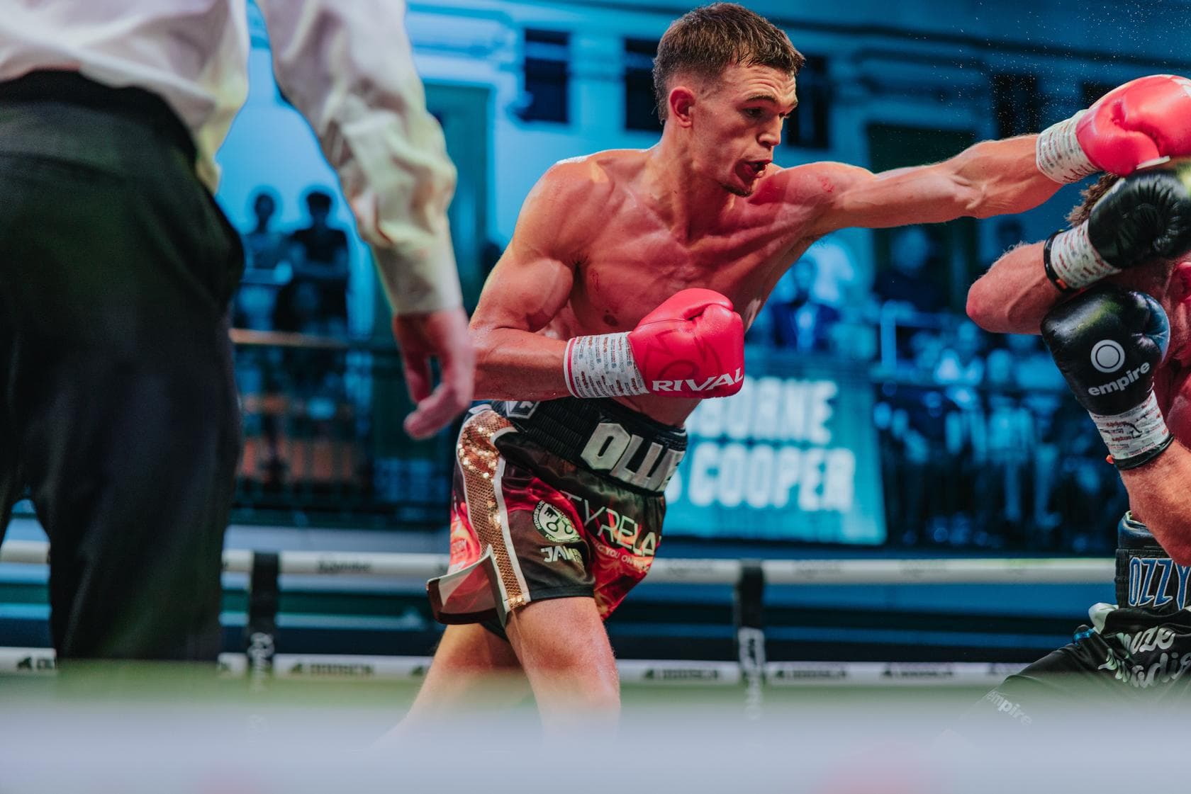Ollie Cooper throws a punch during his bout against James Osborne